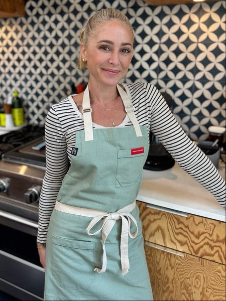 CELEBRATED CHEF AND COOKBOOK AUTHOR BROOKE WILLIAMSON LAUNCHES APRON COLLABORATION WITH “COOKS WHO FEED,” AVAILABLE NOW